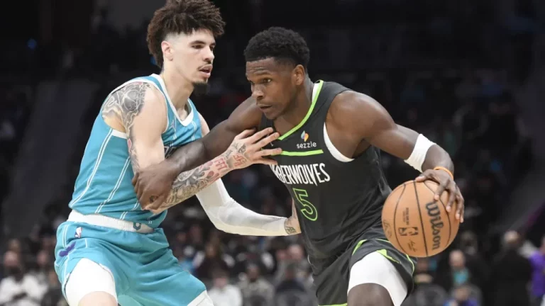 Mar 5, 2025; Charlotte, North Carolina, USA; Minnesota Timberwolves guard Anthony Edwards (5) drives past Charlotte Hornets guard LaMelo Ball (1) during the second half at the Spectrum Center. Mandatory Credit: Sam Sharpe-Imagn Images